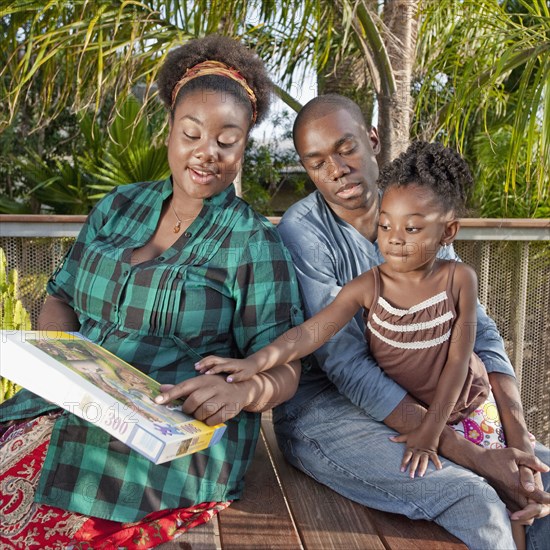 African American woman on patio with family