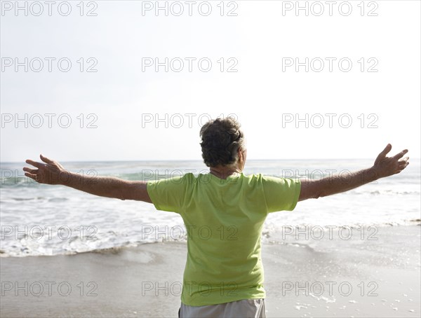 Caucasian man standing on beach