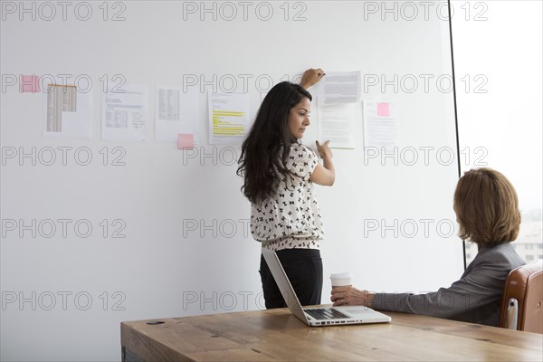 Businesswomen talking in office