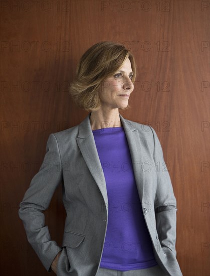 Caucasian businesswoman smiling in office