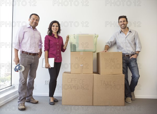 Business people standing in new office