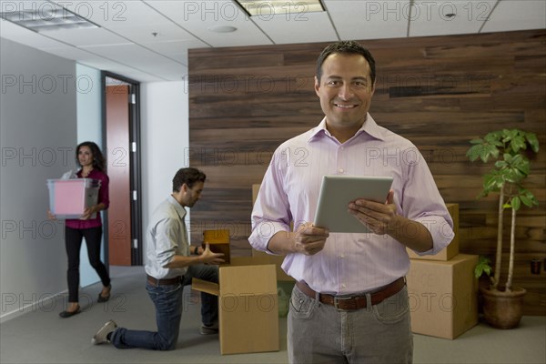 Businessman using digital tablet in office