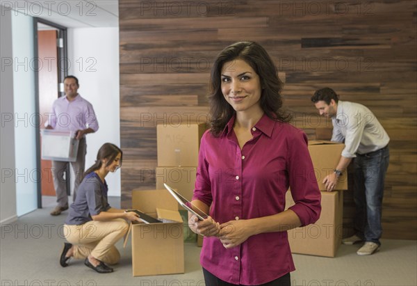 Businesswoman smiling in new office