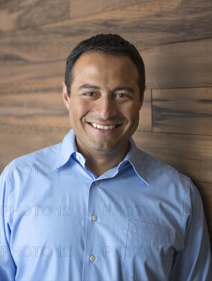 Hispanic businessman smiling