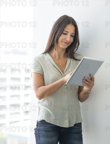 Woman using digital tablet