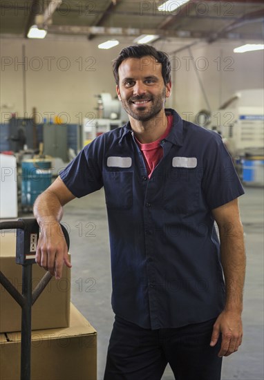 Worker smiling in warehouse