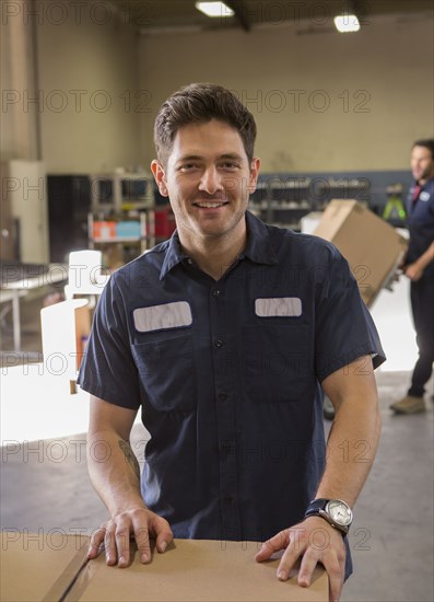 Worker smiling in warehouse