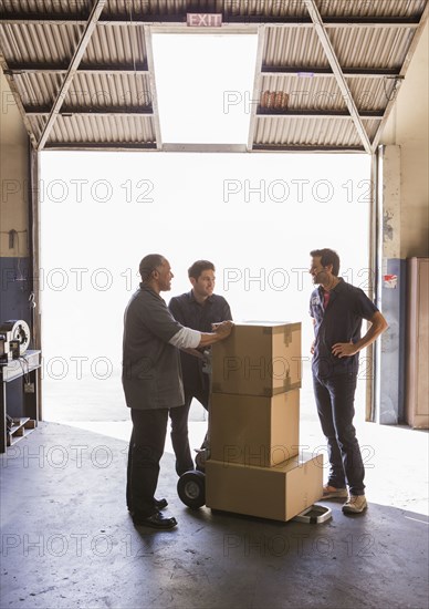 Workers talking in warehouse