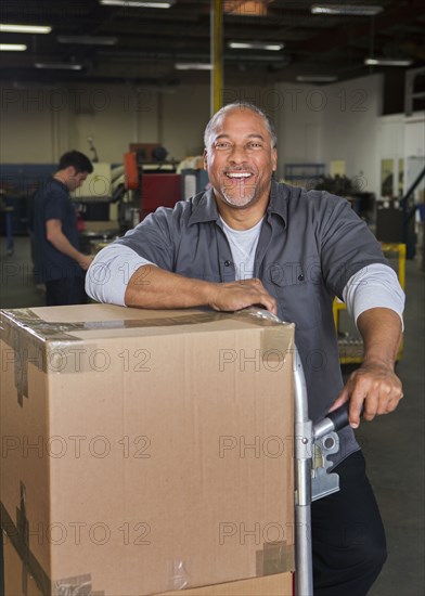 Worker smiling in warehouse