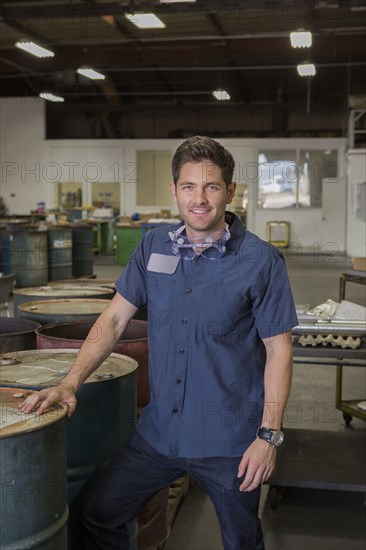 Caucasian worker smiling in warehouse