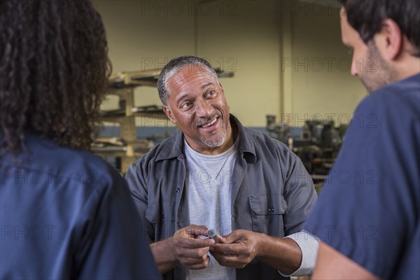 Workers talking in warehouse