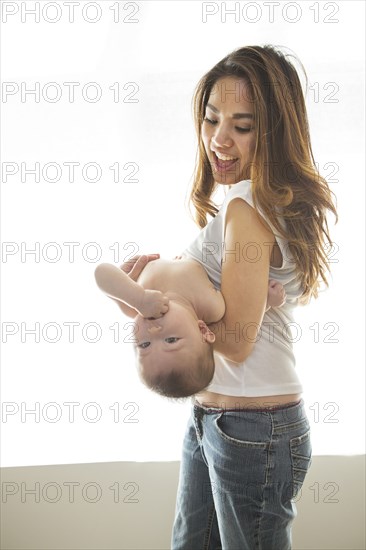 Mother playing with baby girl