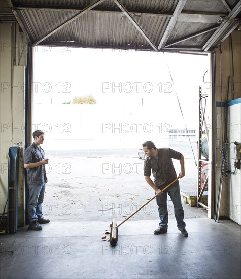 Workers talking at warehouse loading dock