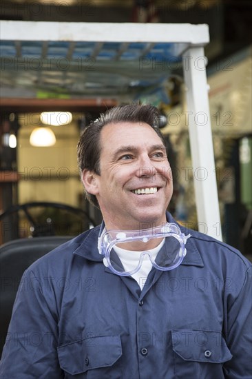 Caucasian worker smiling in warehouse