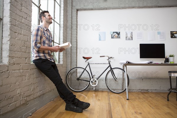 Caucasian architect sitting in office