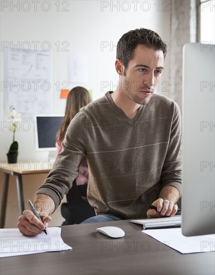 Caucasian architect working in office