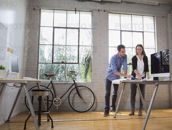 Caucasian architects working in office