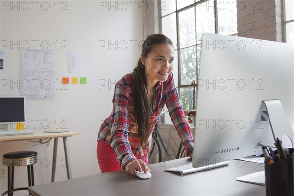 Mixed race architect working in office