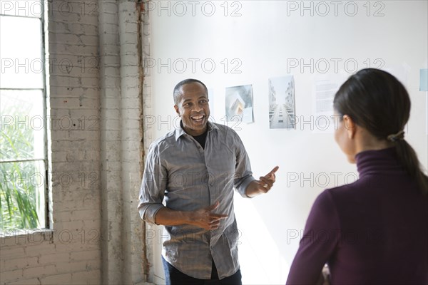 Architects talking in office