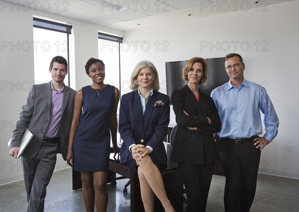 Business people smiling together in office