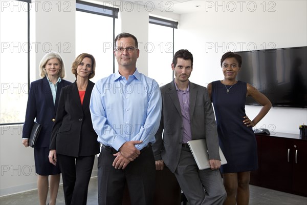 Business people smiling together in office