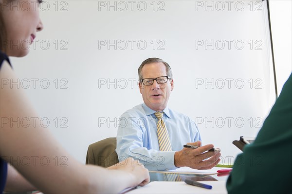 Business people talking in meeting