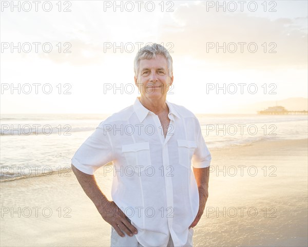 Caucasian man smiling on beach