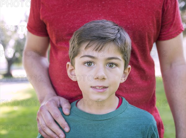 Close up of Caucasian father and son in park