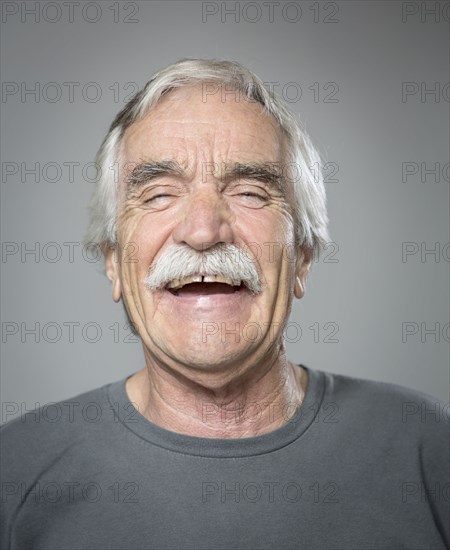 Close up of older Caucasian man laughing