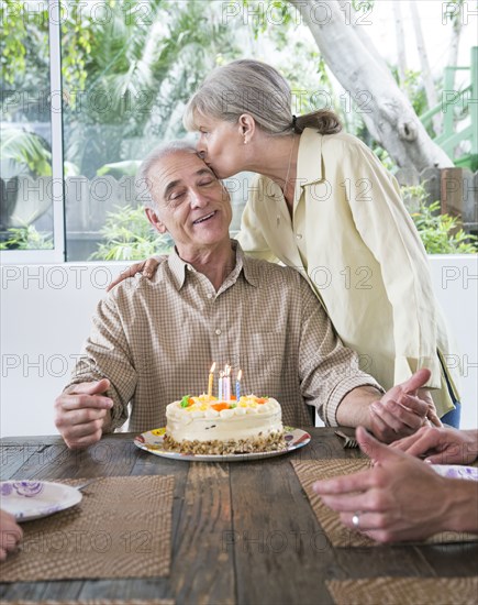 Caucasian family celebrating birthday at table