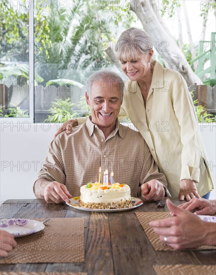 Caucasian family celebrating birthday at table