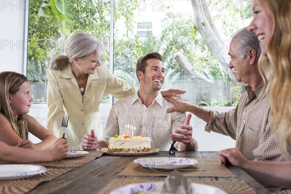 Caucasian family celebrating birthday at table