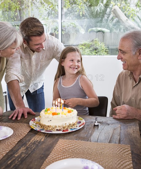 Caucasian family celebrating birthday at table