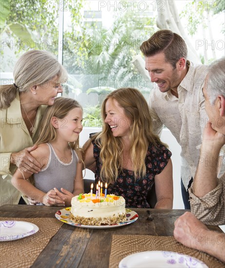 Caucasian family celebrating birthday at table