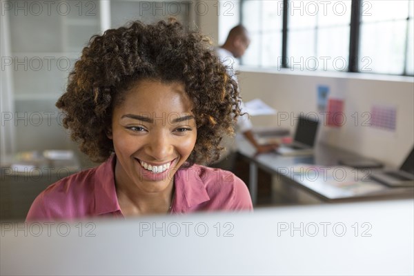 Businesswoman using computer in office