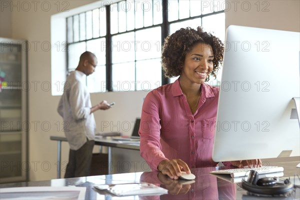 Businesswoman using computer in office