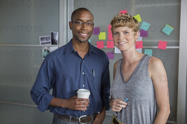 Business people smiling in office