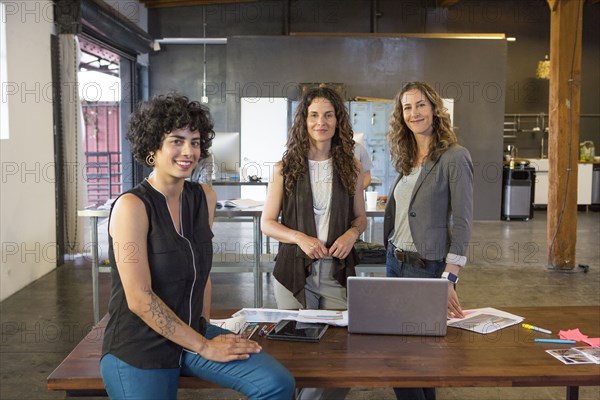 Businesswomen smiling in office