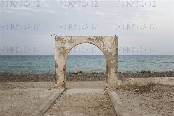 Stone arch over beach