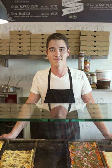 Server smiling in cafe