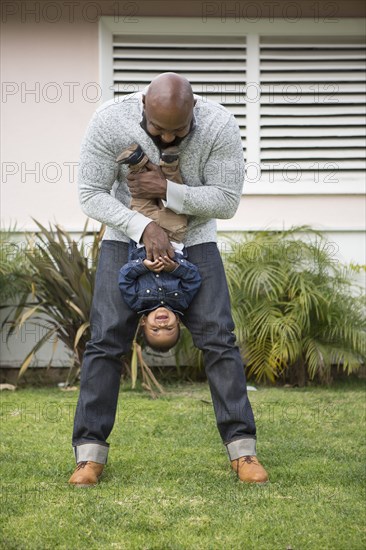 African American father and son playing outdoors