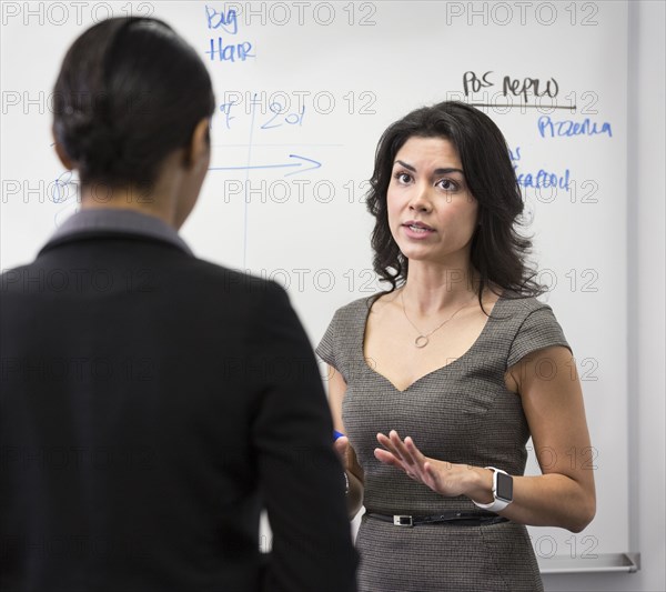 Businesswomen talking in office