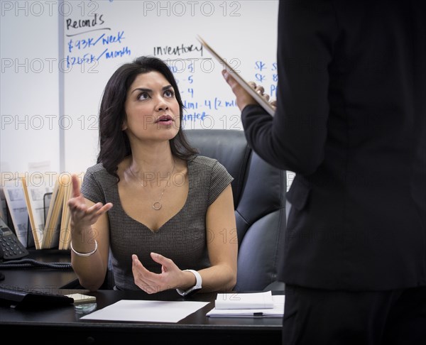 Businesswomen talking in office