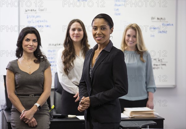 Businesswomen smiling in office