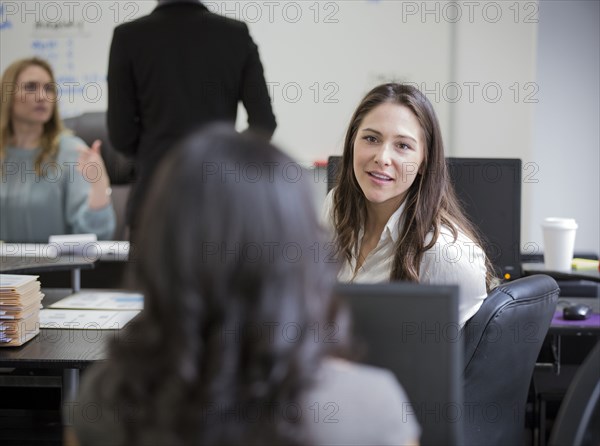 Businesswomen talking in office