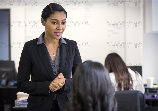 Businesswomen talking in office