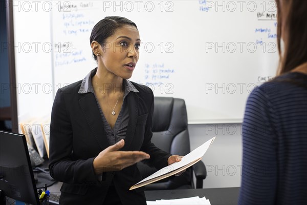 Businesswomen talking in office