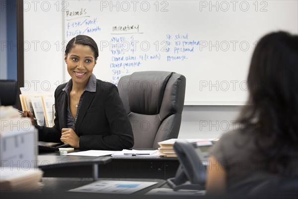 Businesswomen talking in office