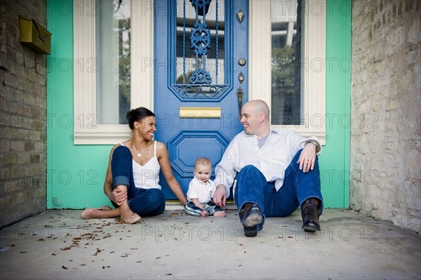 Family sitting in doorway