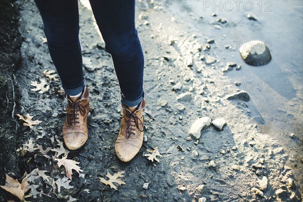 Close up of Caucasian woman standing near puddle